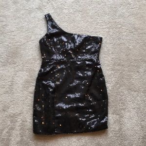 One shoulder black sequin dress.